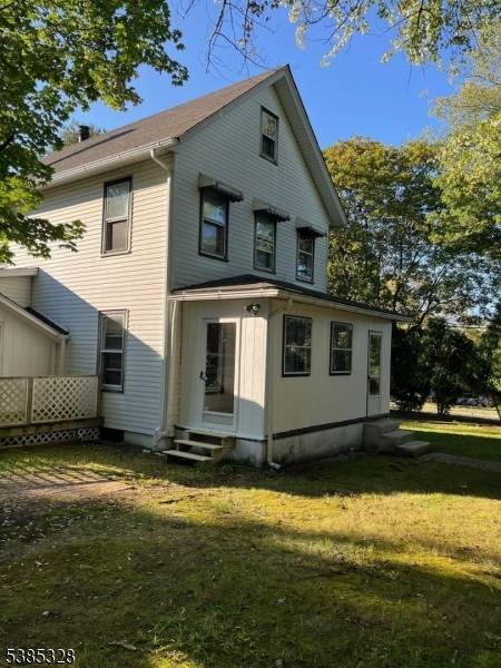 Welcome to this inviting property situated on a generous corner lot with a wide driveway and an oversized, two car garage.