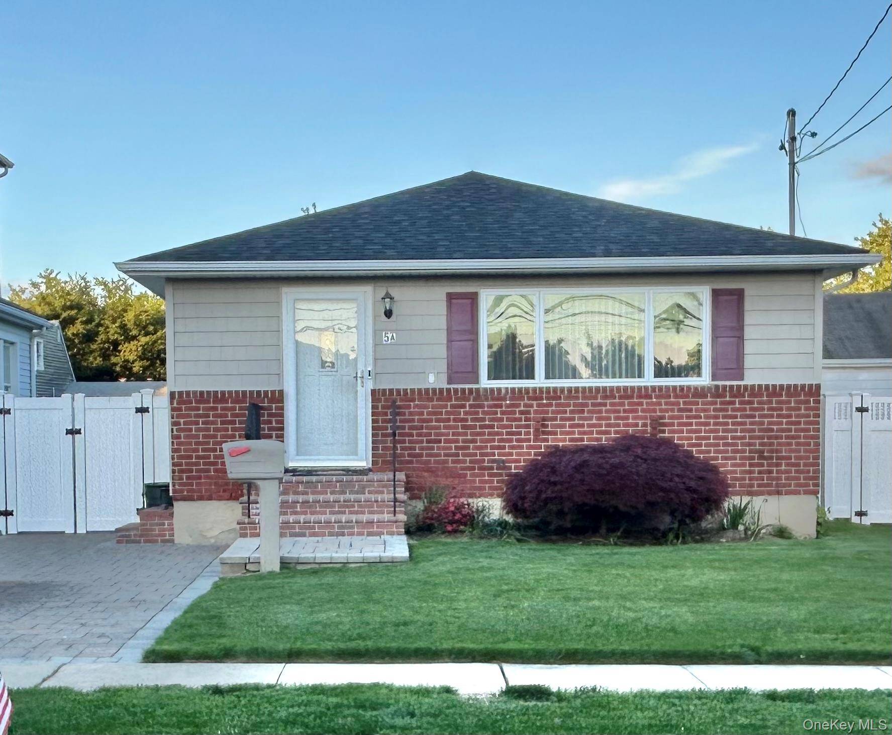 North Hicksville Ranch Nestled on a quiet tree lined street and set on Unique L Shaped Property.