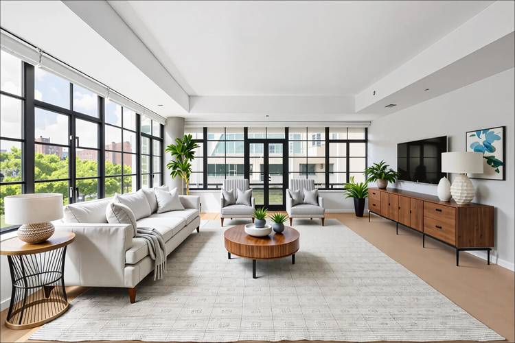 Enjoy luxurious, modern Chelsea loft living with Empire State Building and High Line views in this dazzling corner condo with private outdoor space.