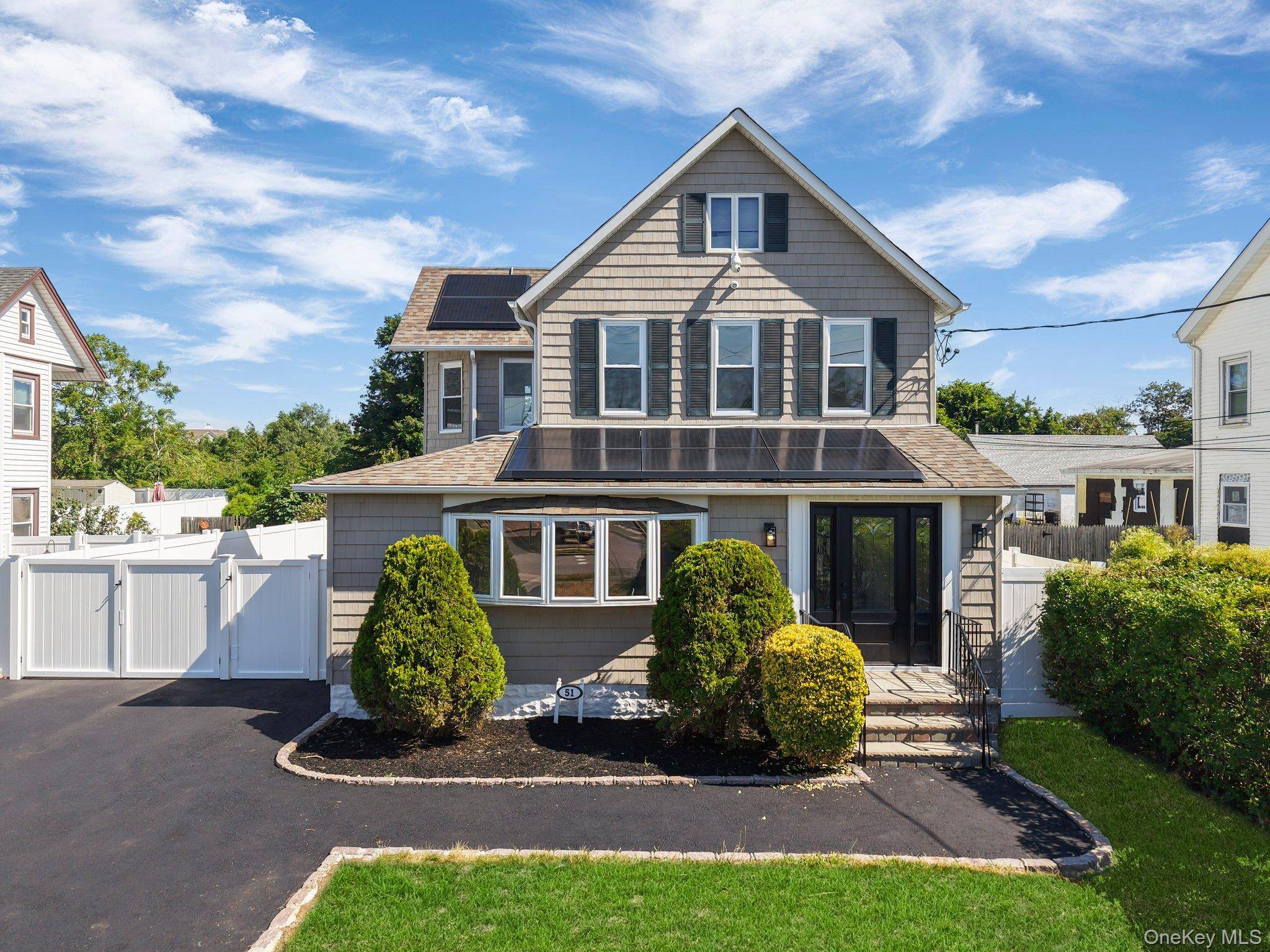 Welcome to 51 Sterling Place in the heart of Amityville Village and a commuter's delight.