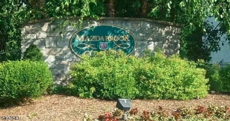 Welcome to this beautifully maintained home in the highly desirable Mazda Brook community, known for its low HOA fees and easy commute to the city.