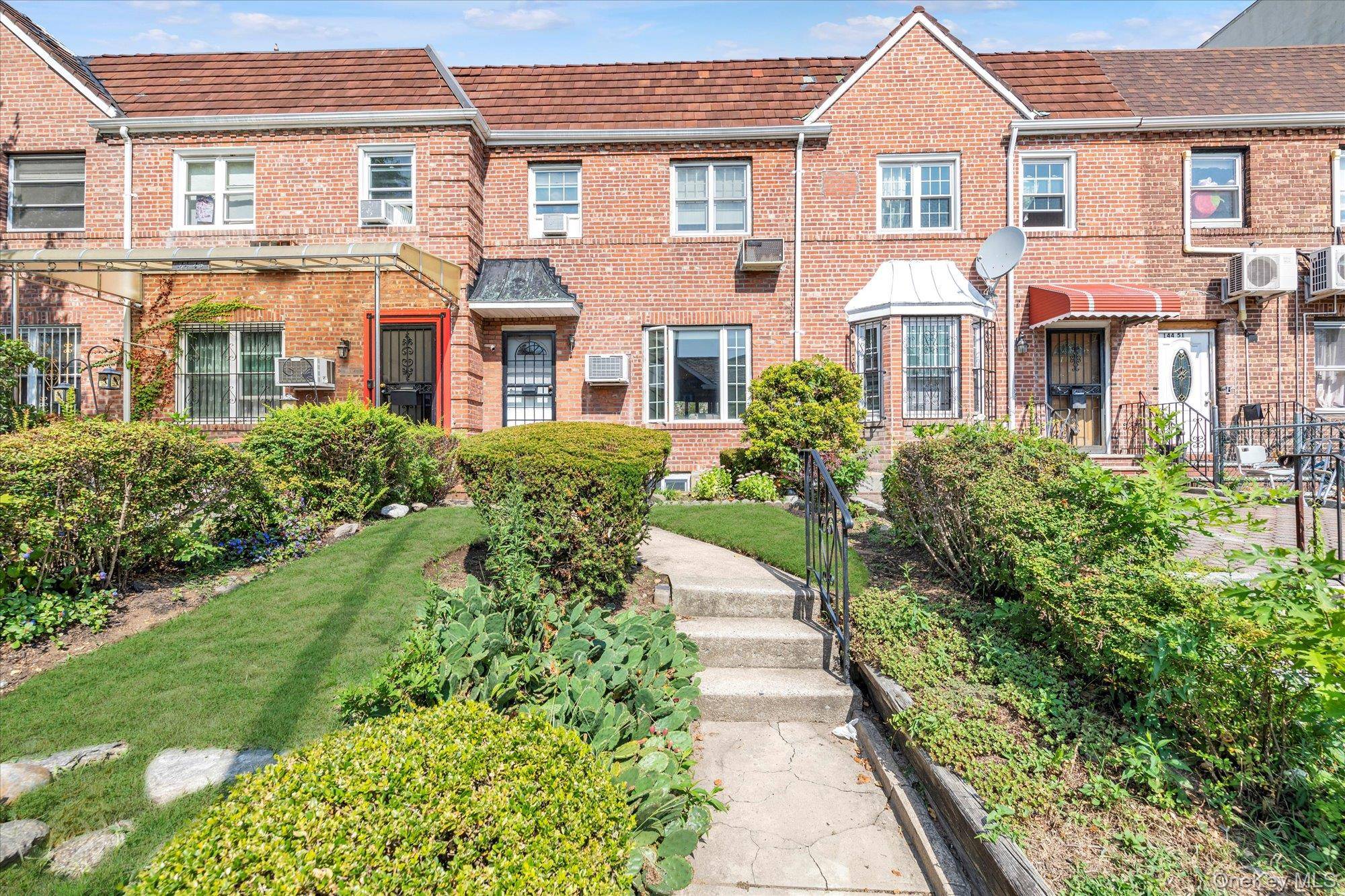 Charming and Sunny All Brick Attached Colonial on a Great Block in the Heart of Kew Garden Hills Flushing.
