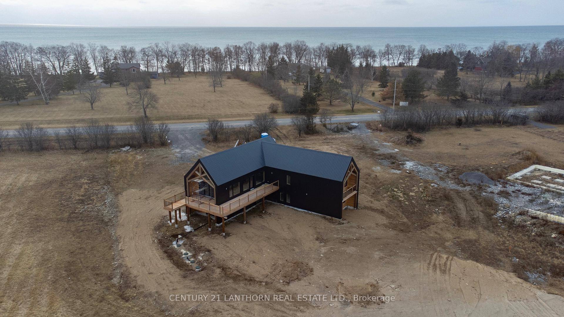 Welcome to a unique opportunity to own a stunning architecturally designed home nestled between Huycks Bay and Lake Ontario.