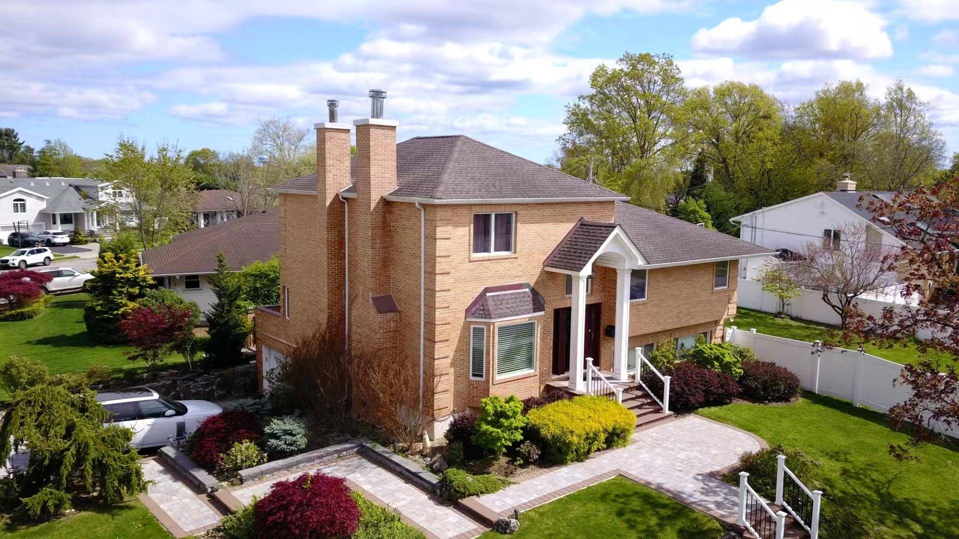 Welcome to this stunning 5 bedroom, 4 bathroom corner huge brick split level home, spacious primary suite on the second level, and the second master room in the upstairs allowing ...
