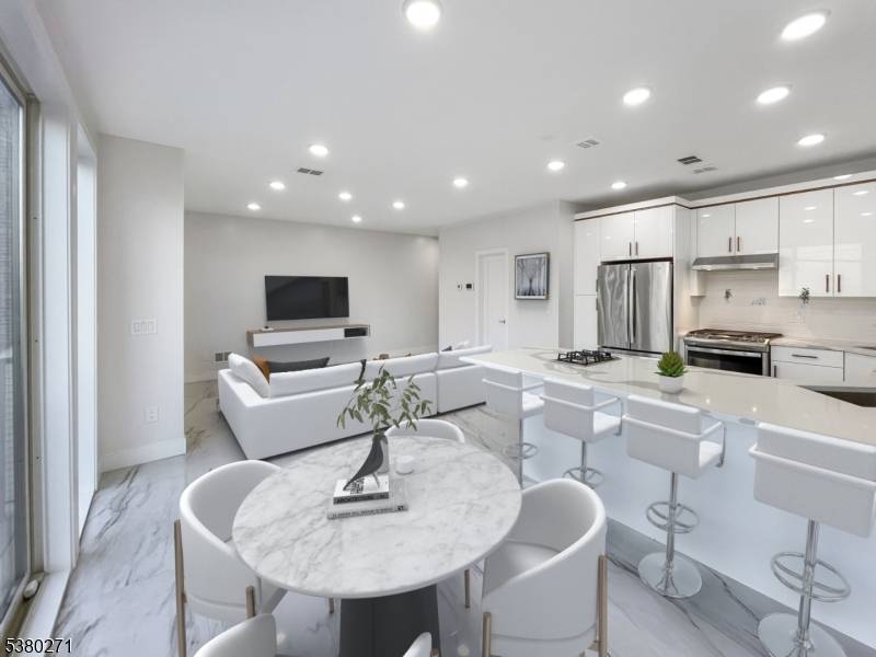 PREPARED TO BE WOWED ! This stunning, newly crafted 2 family home is a beautiful blend of modern convenience and elegant design.