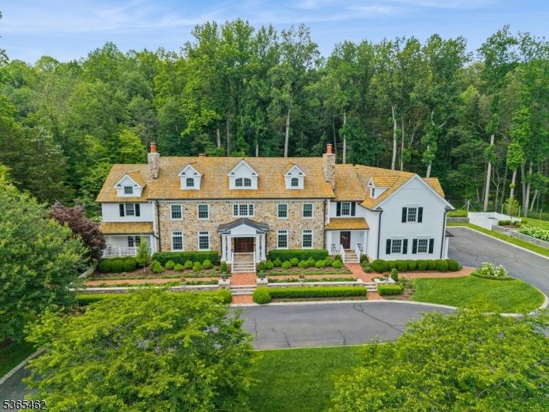 This stunning renovated Mendham estate is a unique property situated on 5.