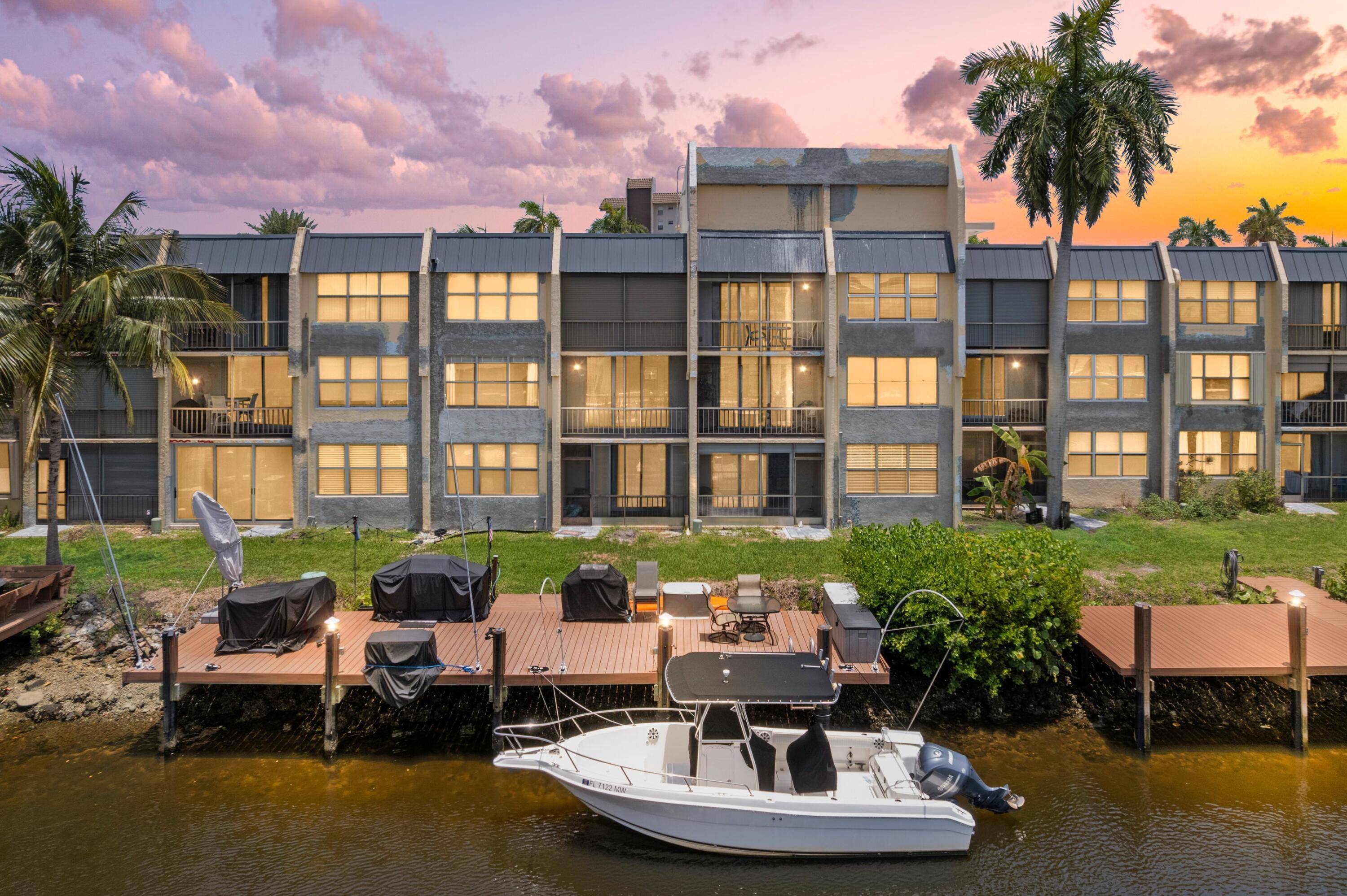 ABSOLUTELY GORGEOUS WATERFRONT CONDO 2ND FLOOR PRIVATE BALCONY WITH BREATHTAKING INTRACOASTAL VIEWS Bright Open Floor Plan Custom Lighting Stunning Kitchen Granite Counters White Wood Cabinets S S Appliances Serving Window ...