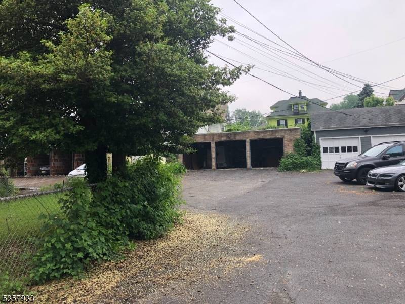 This Classic 2 Family has beautiful natural wood, hardwood floors 2 furnaces separate electric, 3 car garage.