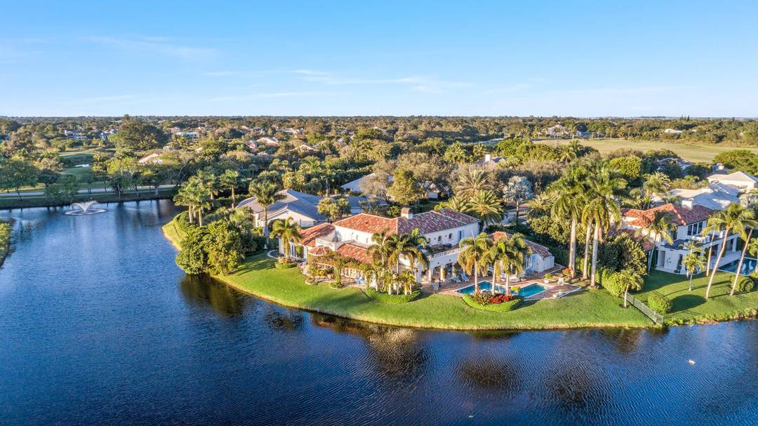 It is rare to find a home on the private enclave of Fairway Island in Palm Beach Polo Country Club available let alone one this outstanding.