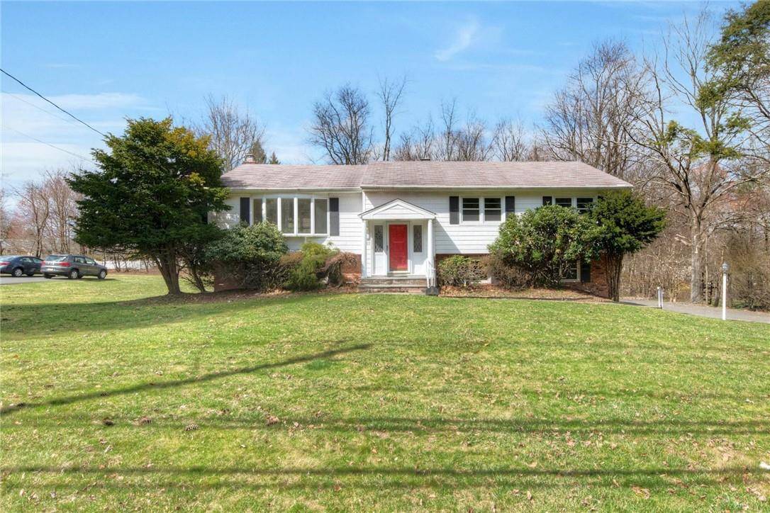 This stunning bi level home features four bedrooms, two and a half baths, and a custom granite eat in kitchen.