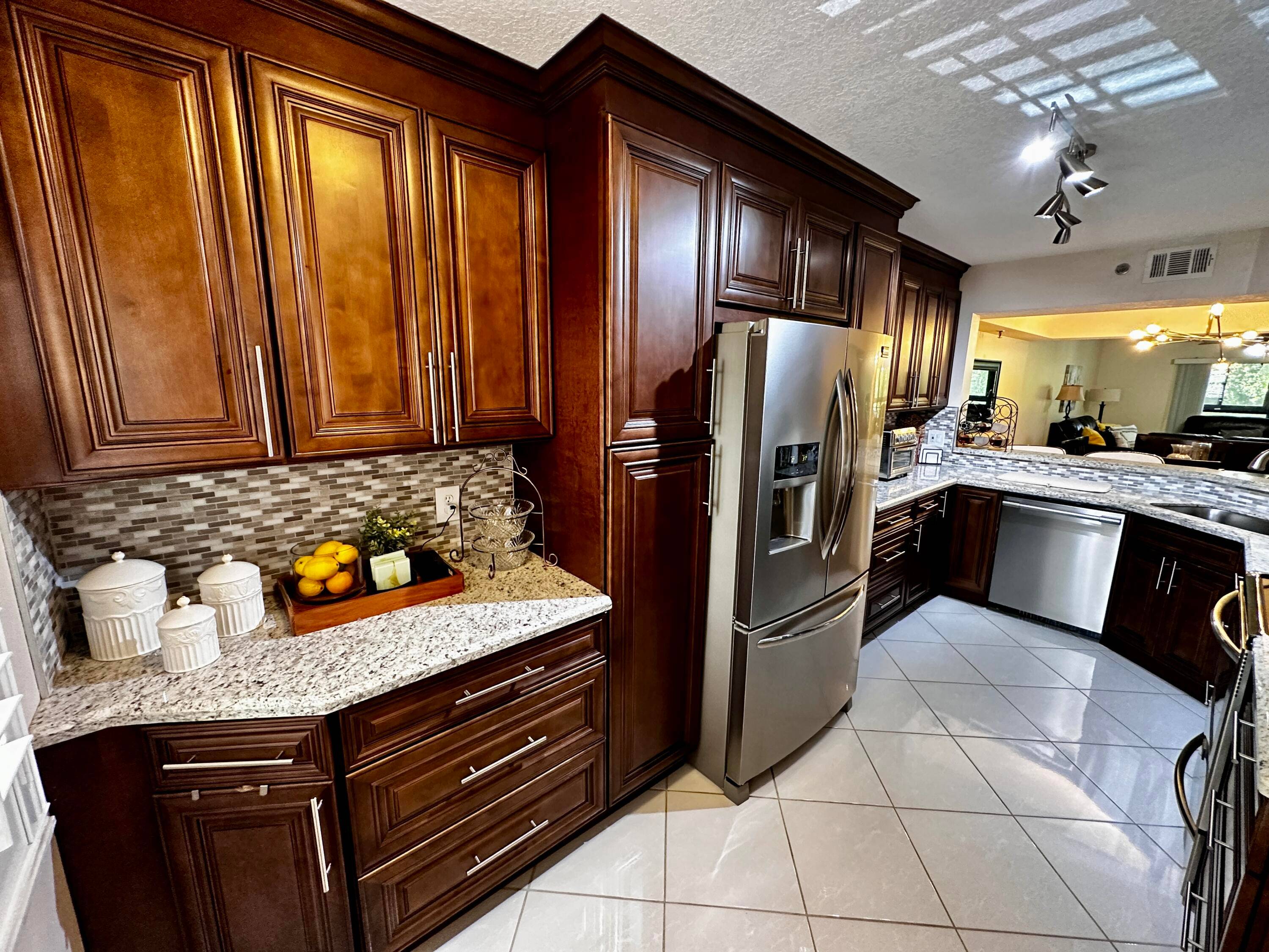 Welcome to your dream condo in the heart of Boca Raton's sought after Pines at Boca Barwood !