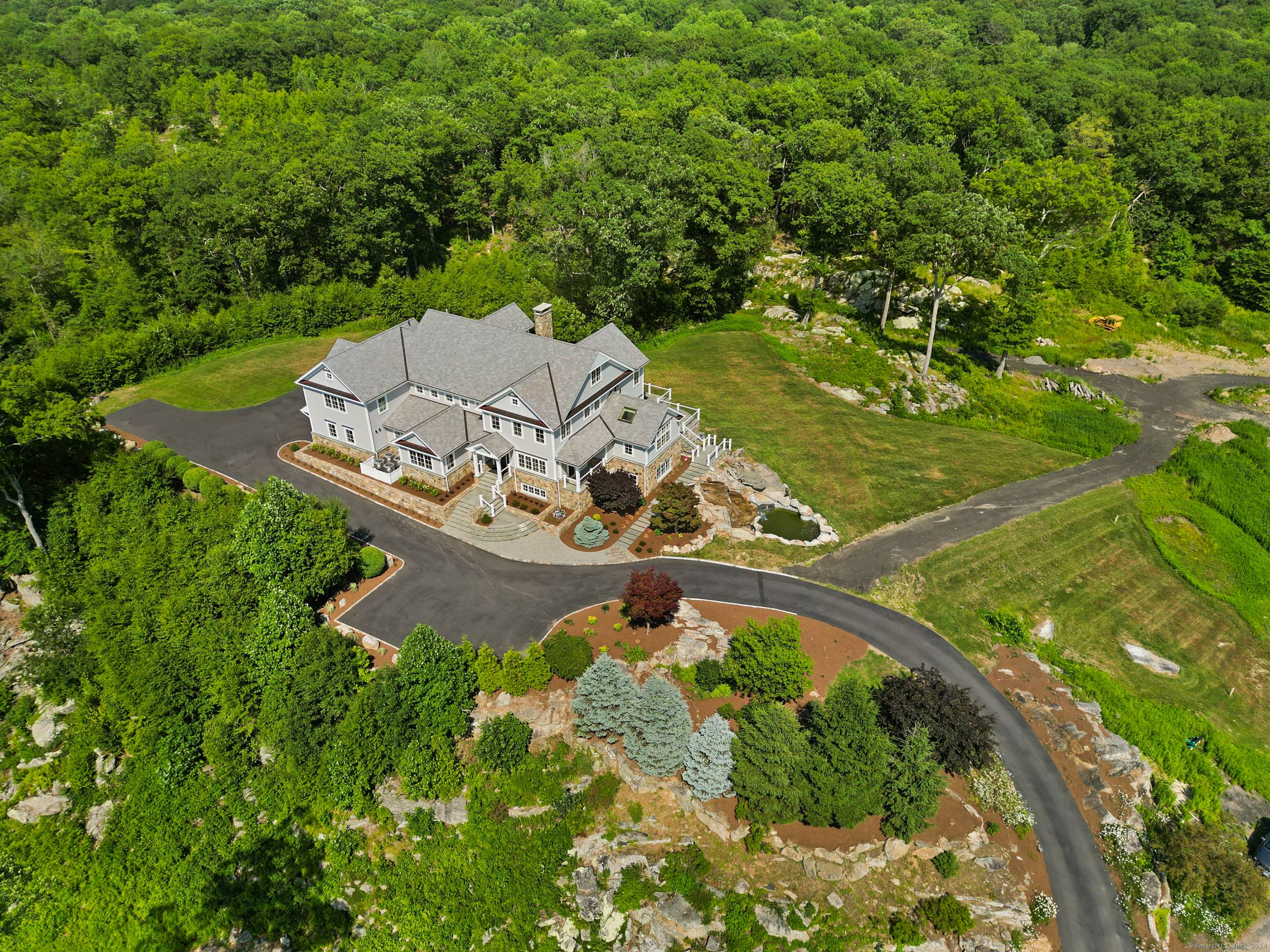This exquisite custom estate with pool site on 4.