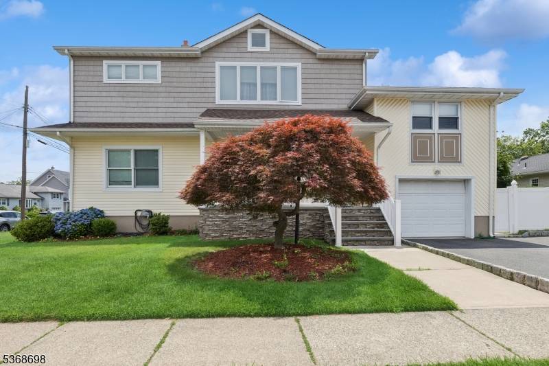 . This bright and airy contemporary home on a corner lot features five bedrooms and five bathrooms.
