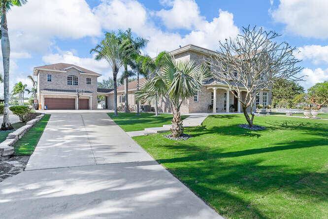 Discover luxury and privacy at this stunning 7 bedroom, 6 bathroom equestrian estate home in West Boca Raton.