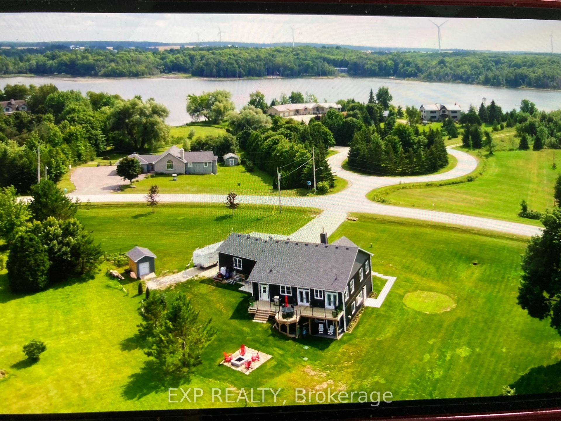 This custom bungalow on Brewster's Lake is a rare gem licensed for short term rentals and set on a beautifully landscaped lot of over 1 acre.