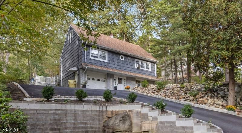 Beautifully renovated home located in a desirable lake community, featuring four spacious bedrooms and 2.