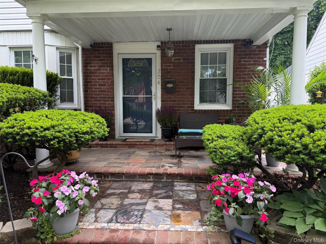 Welcome home to this tastefully renovated Colonial featuring a welcoming front porch and timeless architectural style.