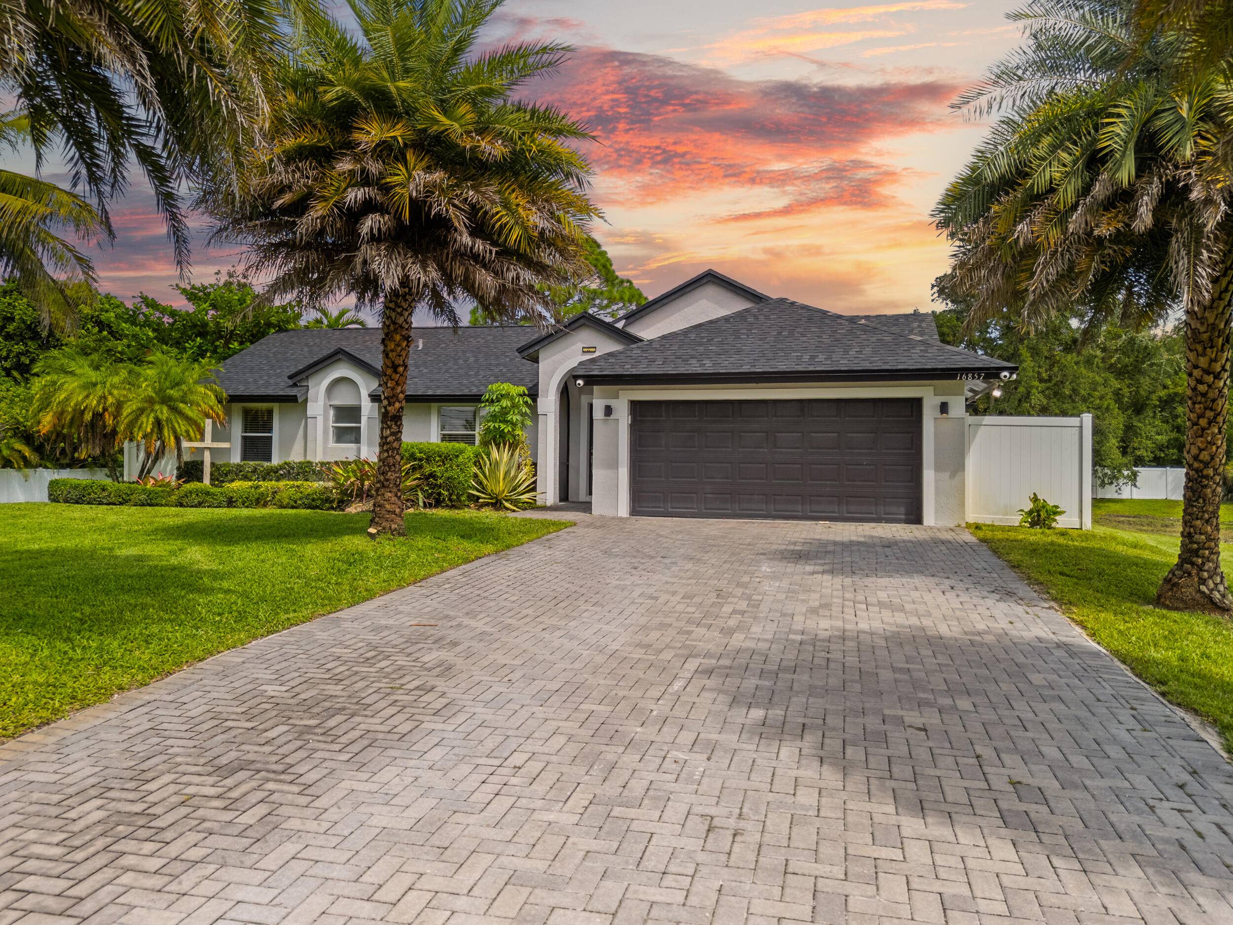 Renovated property with brand new roof 2025 Water Heater 2025, AC in Garage, New Water System, New Pool Pump, Fence in the front, All new plumbing fixtures.