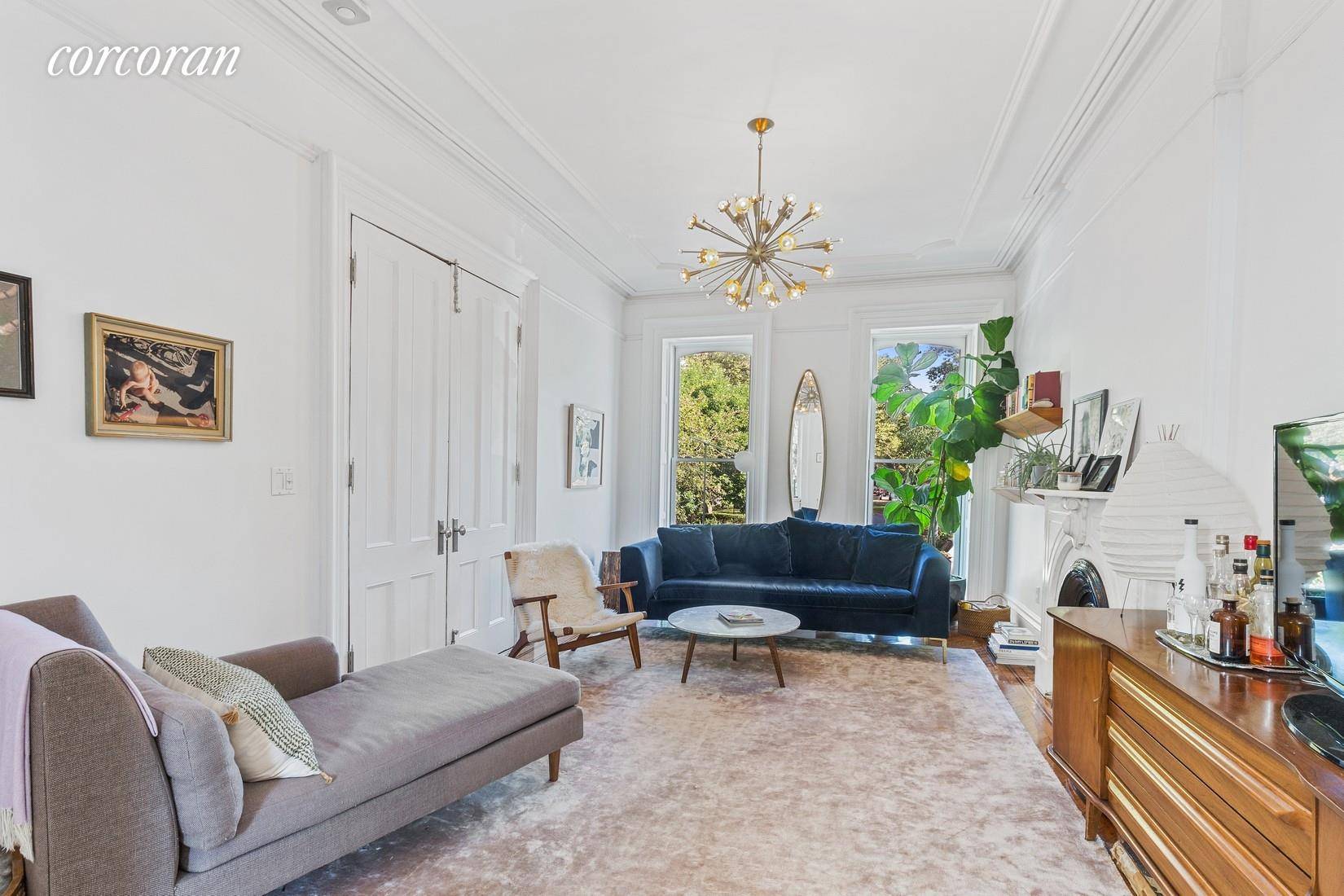Fabulous spacious, sunny two bedroom, two full bath triplex with patio and expansive backyard garden in the center of Clinton Hill.