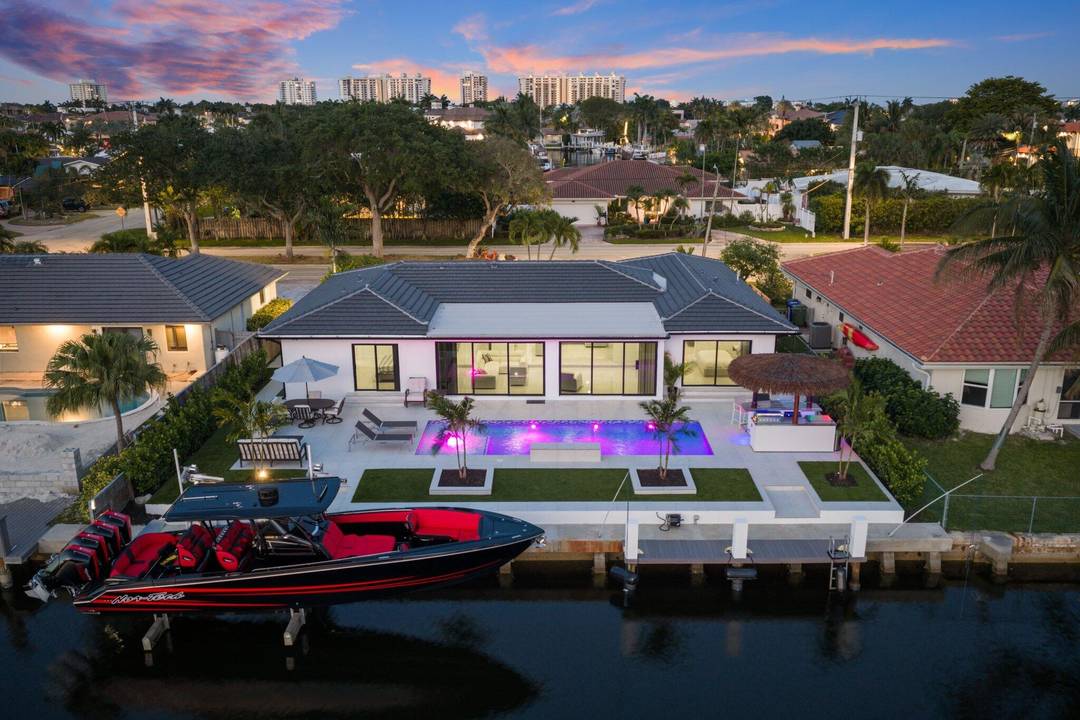 80 ft waterfront. Brand new outdoor kitchen tiki hut, and 17, 000 lb elevator lift.