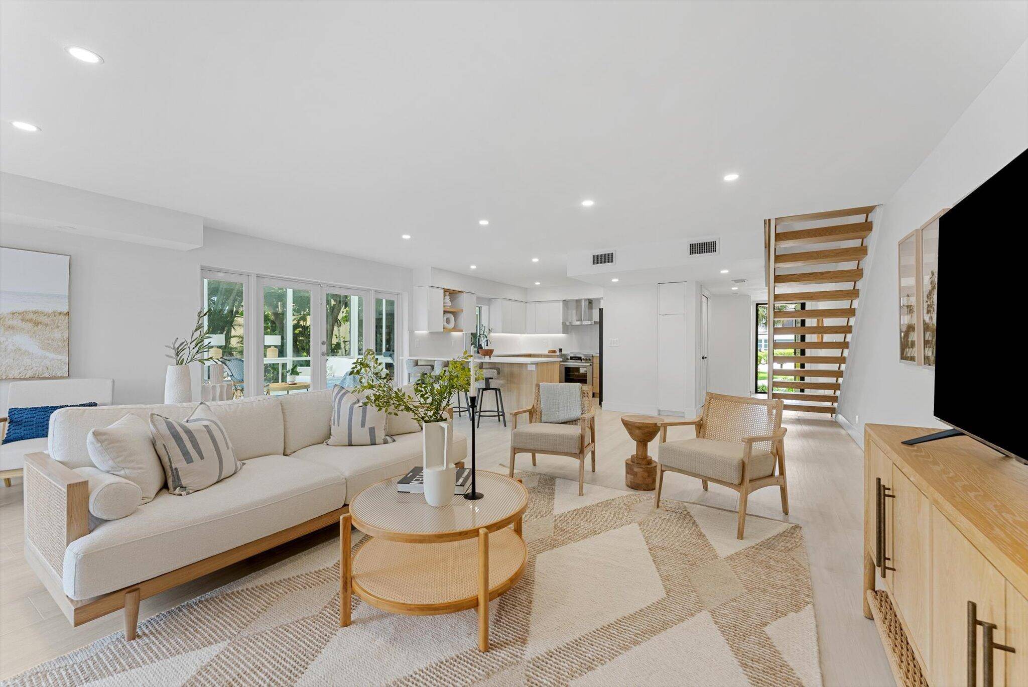 Welcome to 1013 Bel Air Dr 1, an extraordinary waterfront coastal modern townhome in the heart of Highland Beach, where luxury and sophistication meet tranquil waterside living.
