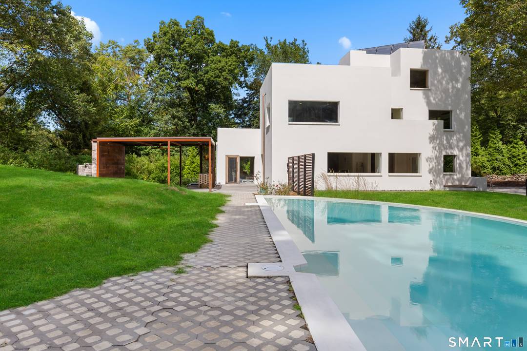 This Westport residence is a meticulously executed Passive House retrofit of a modernist concrete home originally built in 1938.