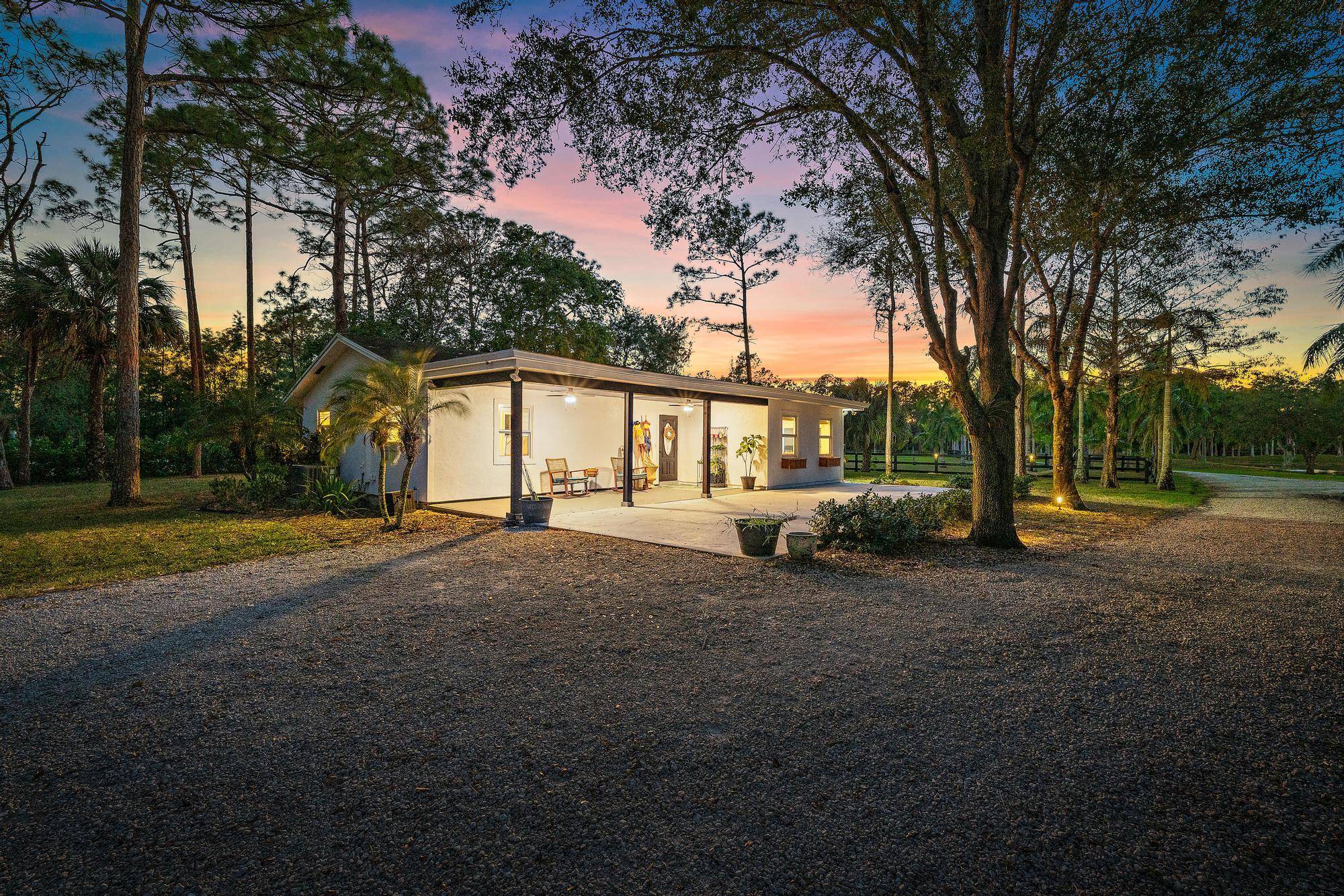 Welcome to 14765 128th Avenue N, a rare opportunity to own over 10 serene acres in the heart of Palm Beach Gardens where tranquility meets functionality for equestrian enthusiasts, nature ...