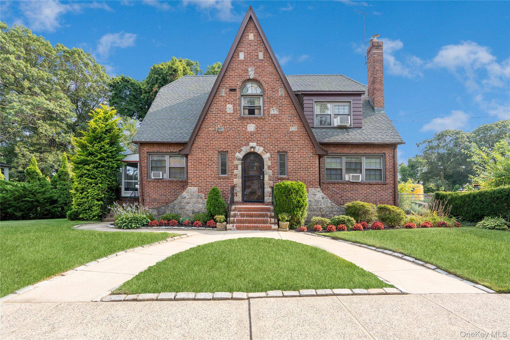 Welcome to this Charming legal 2 family Tudor home Ideal for investment or multigenerational living !