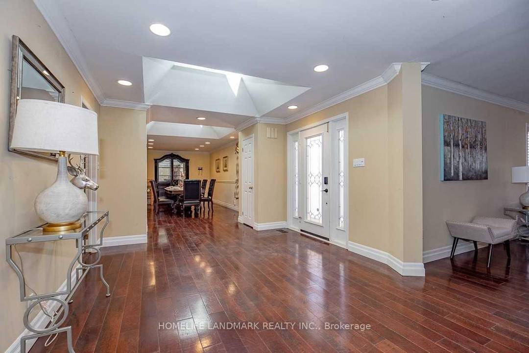 Located in a coveted Southeast Oakville enclave south of Lakeshore Road, this exceptional custom bungalow is set among mature trees and distinguished residences, just moments from Lake Ontario.