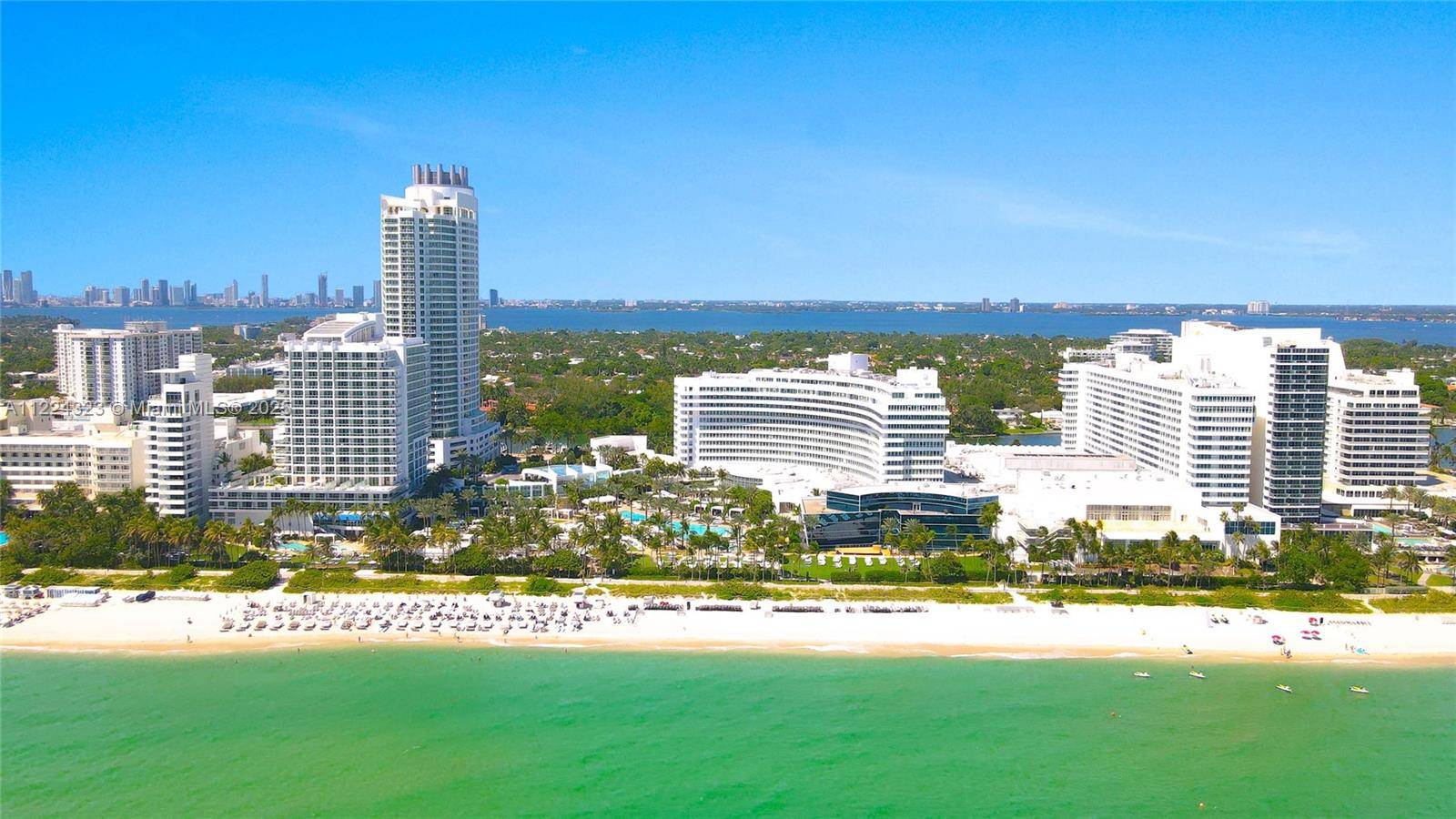 Indulge in spectacular southern facing views of the ocean, bay, and intracoastal from this exquisite 2 bedroom, 3 bathroom unit in Fontainebleau II.