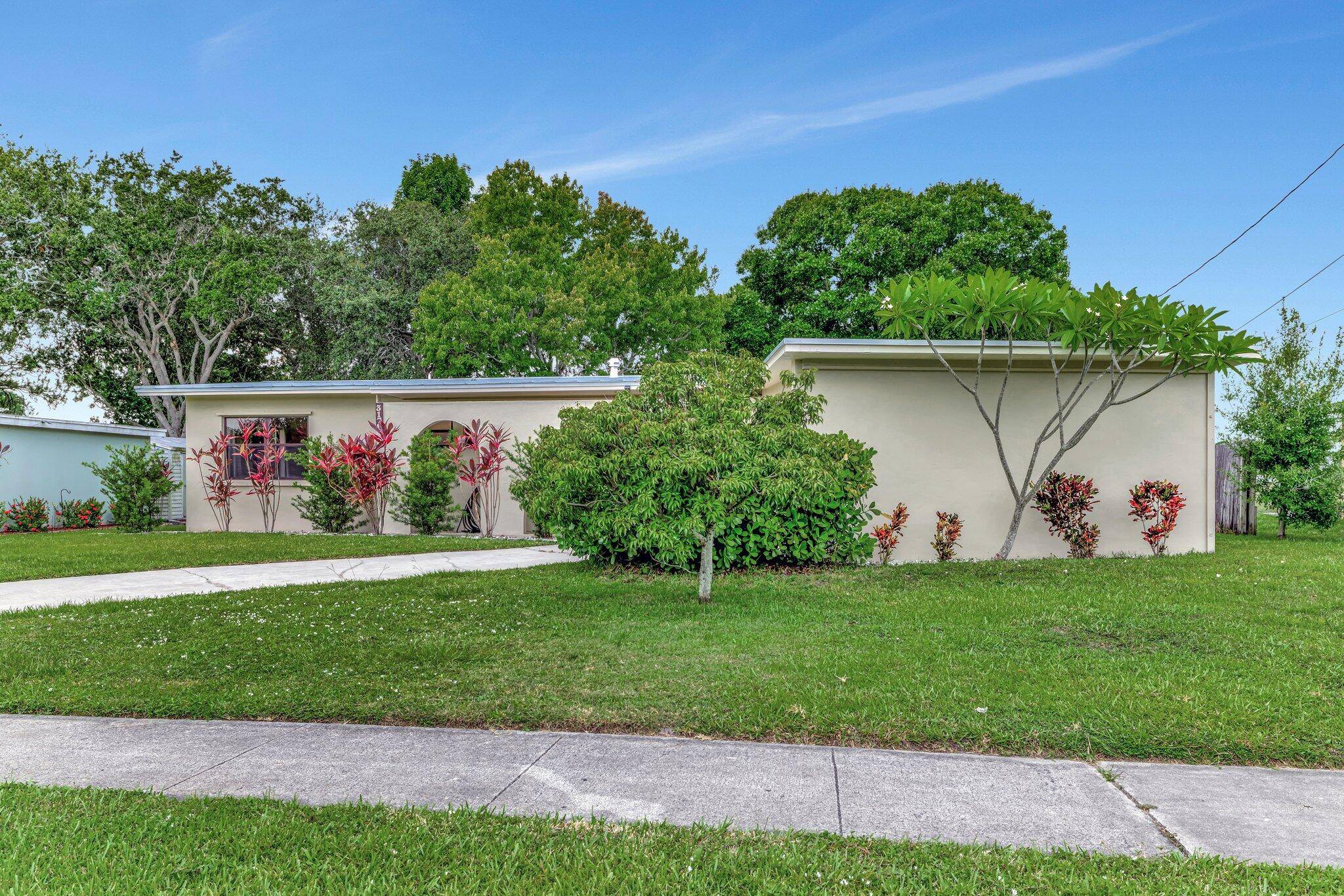 Beautiful 3 Bedroom, 2 Bathroom, 1 Car Garage Home in the Desirable Sandpiper Bay Area Across From Lake for Privacy.