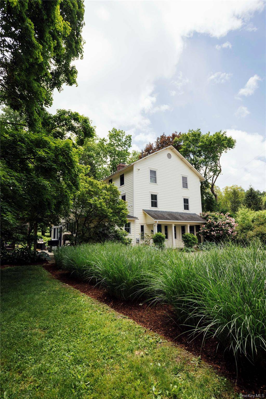 This c. 1880 three story farmhouse seamlessly blends historic charm with modern luxury, meticulously cared for and thoughtfully curated to offer both timeless elegance and contemporary comfort.