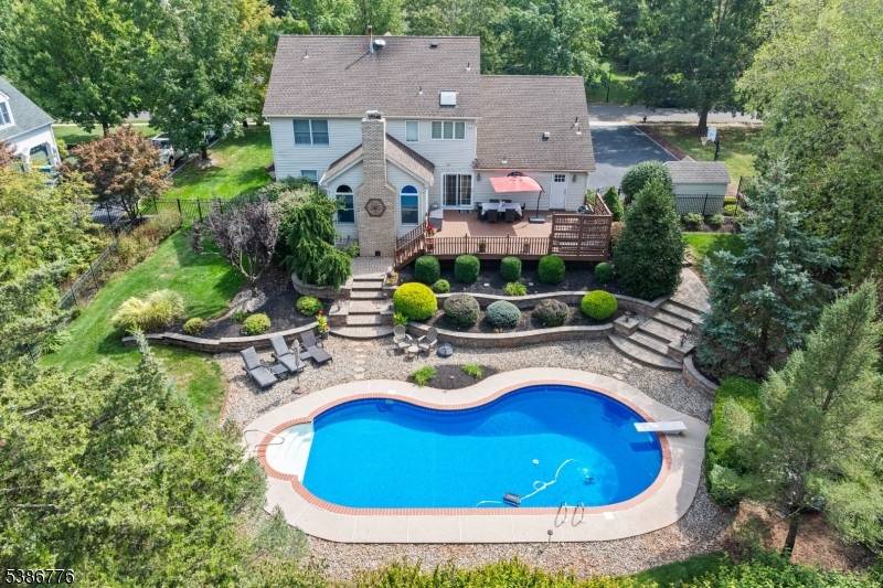 Completely renovated with a modern flair, this Country Classics showstopper is the total package featuring a finished basement, expansive deck and sparkling in ground pool !