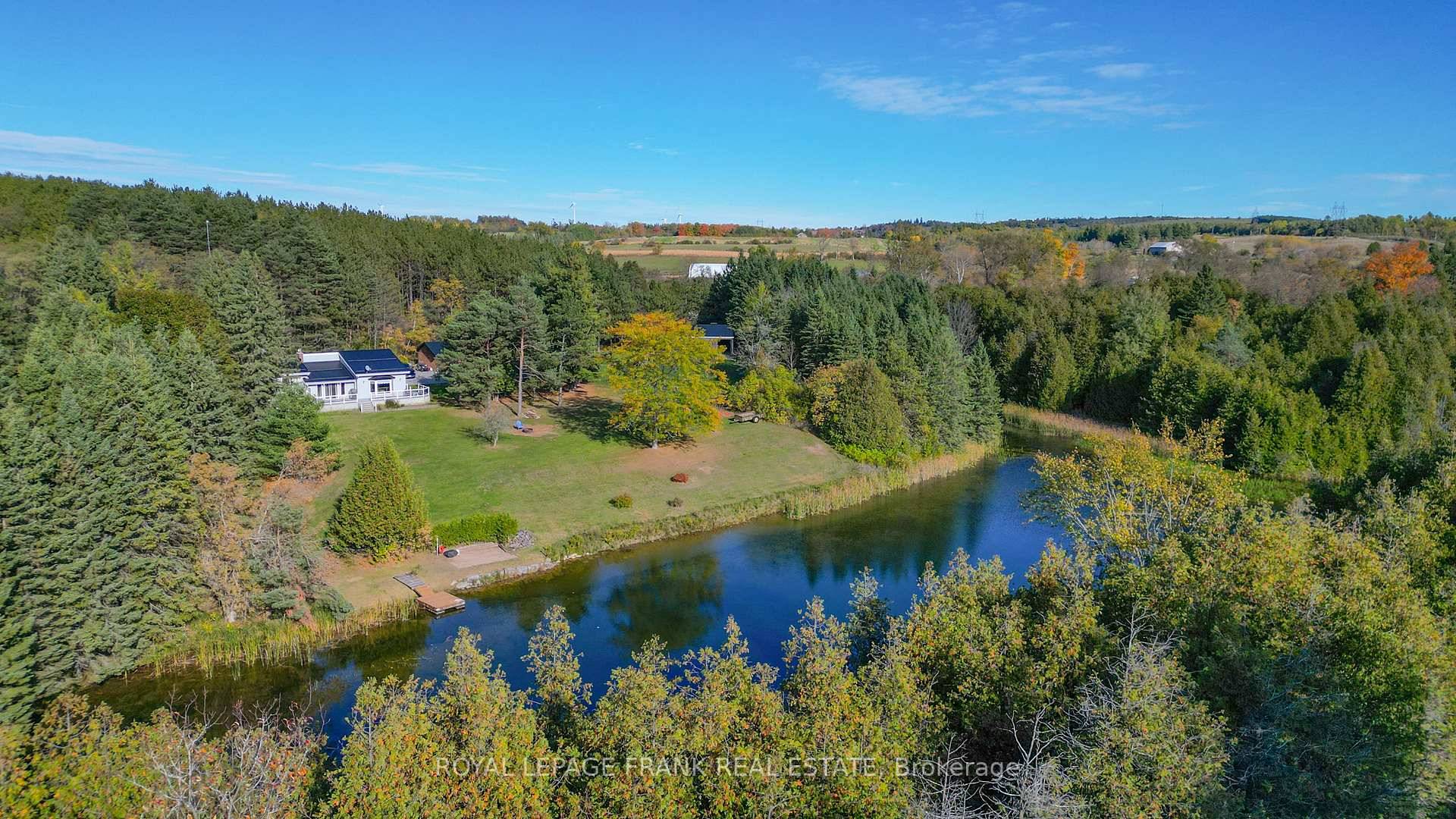 Scenic 2 bedroom raised bungalow on 40 acres with pond, horse barn amp ; workshop.