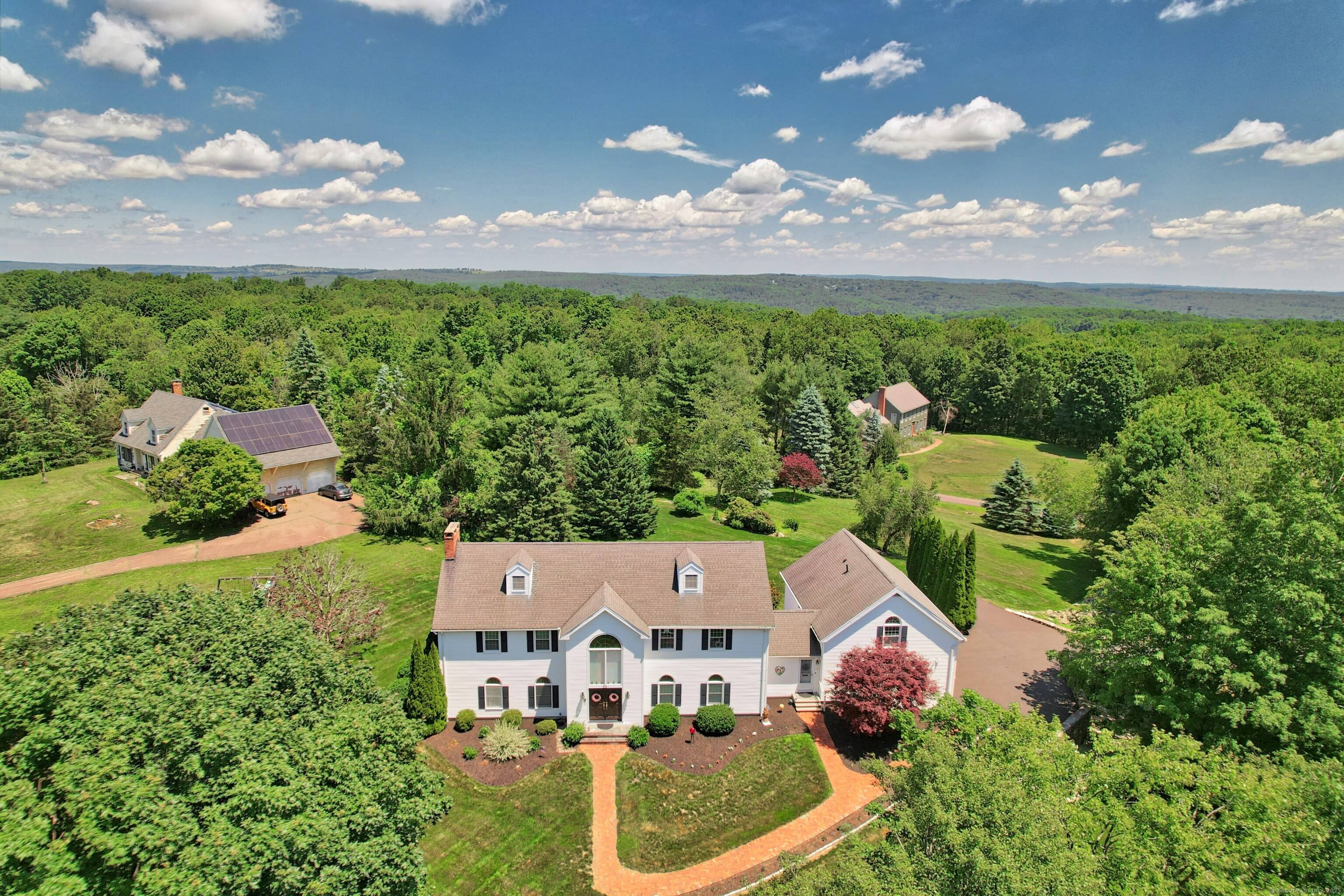 PRICE IMPROVEMENT Welcome to this Majestic Colonial home, nestled on a picturesque 1.