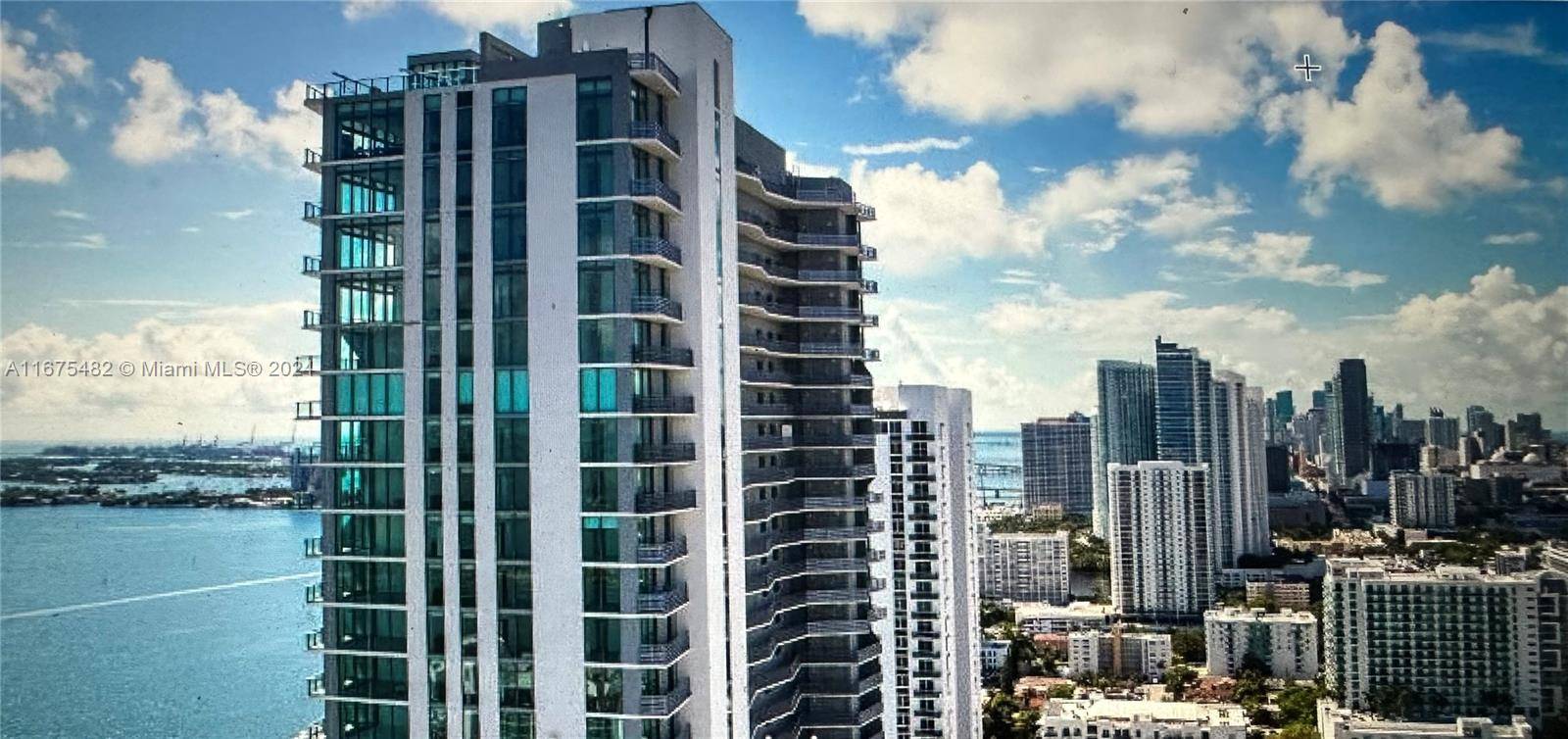 bayfront condominium with private elevator access, 9 foot high ceilings with floor to ceiling glass windows, Italian kitchen, an in unit washer and dryer, and a private balcony offering views ...