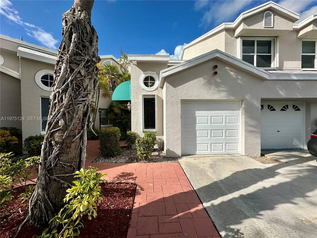 This beautiful 3 2 condo with a garage and stunning lake view is in the desirable Grand Palms gated community in West Pembroke Pines.