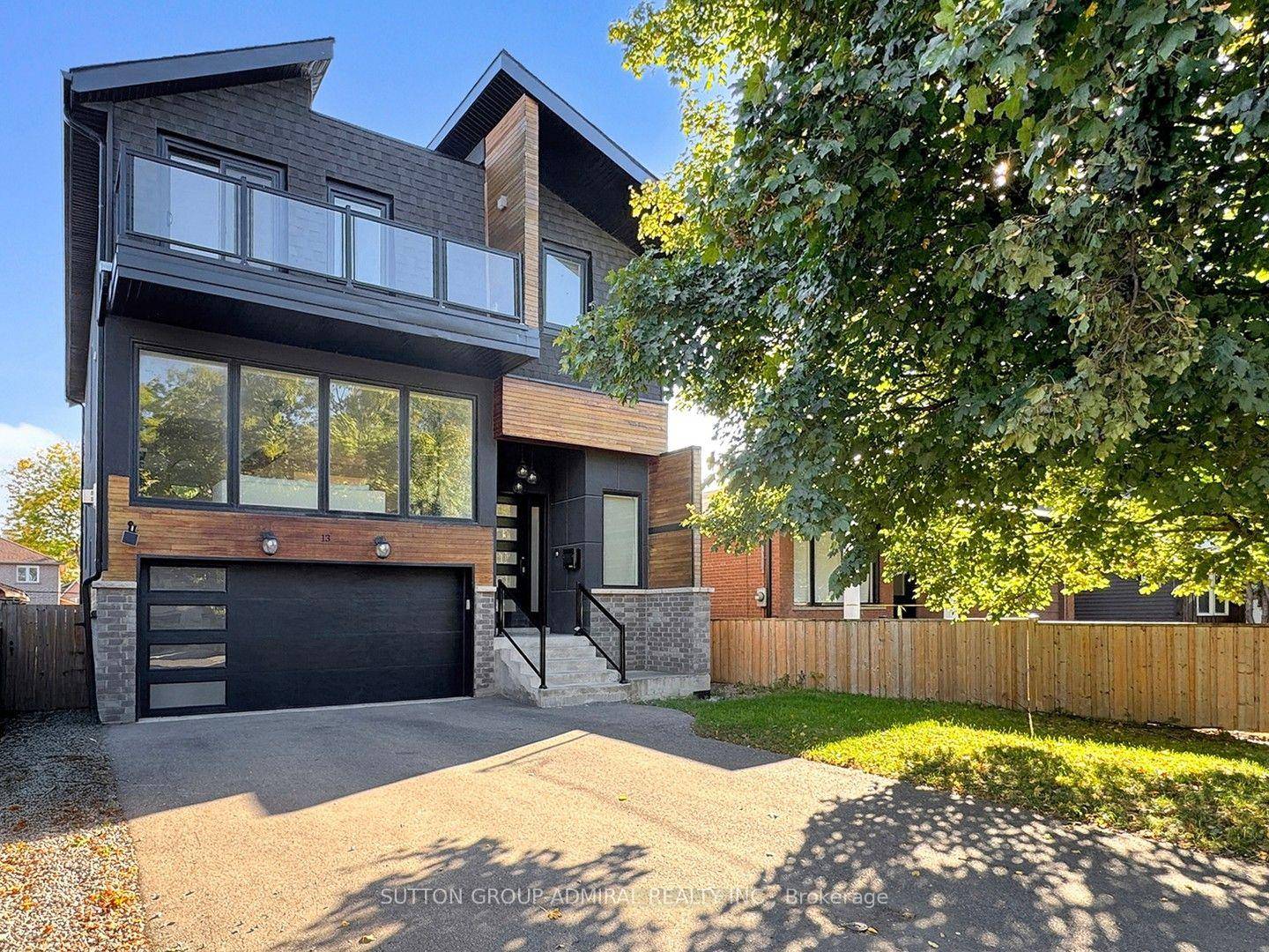 Welcome to 13 Elder Avenue a custom built modern home on a rare 40 ft lot in a family friendly community that perfectly blends city convenience with lakeside living.