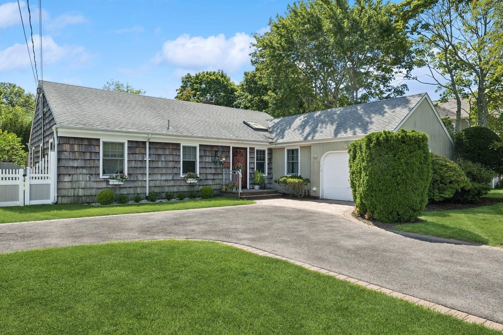 Your Late Summer Getaway awaits at this spacious Hampton Bays Ranch home located south of Montauk Highway.