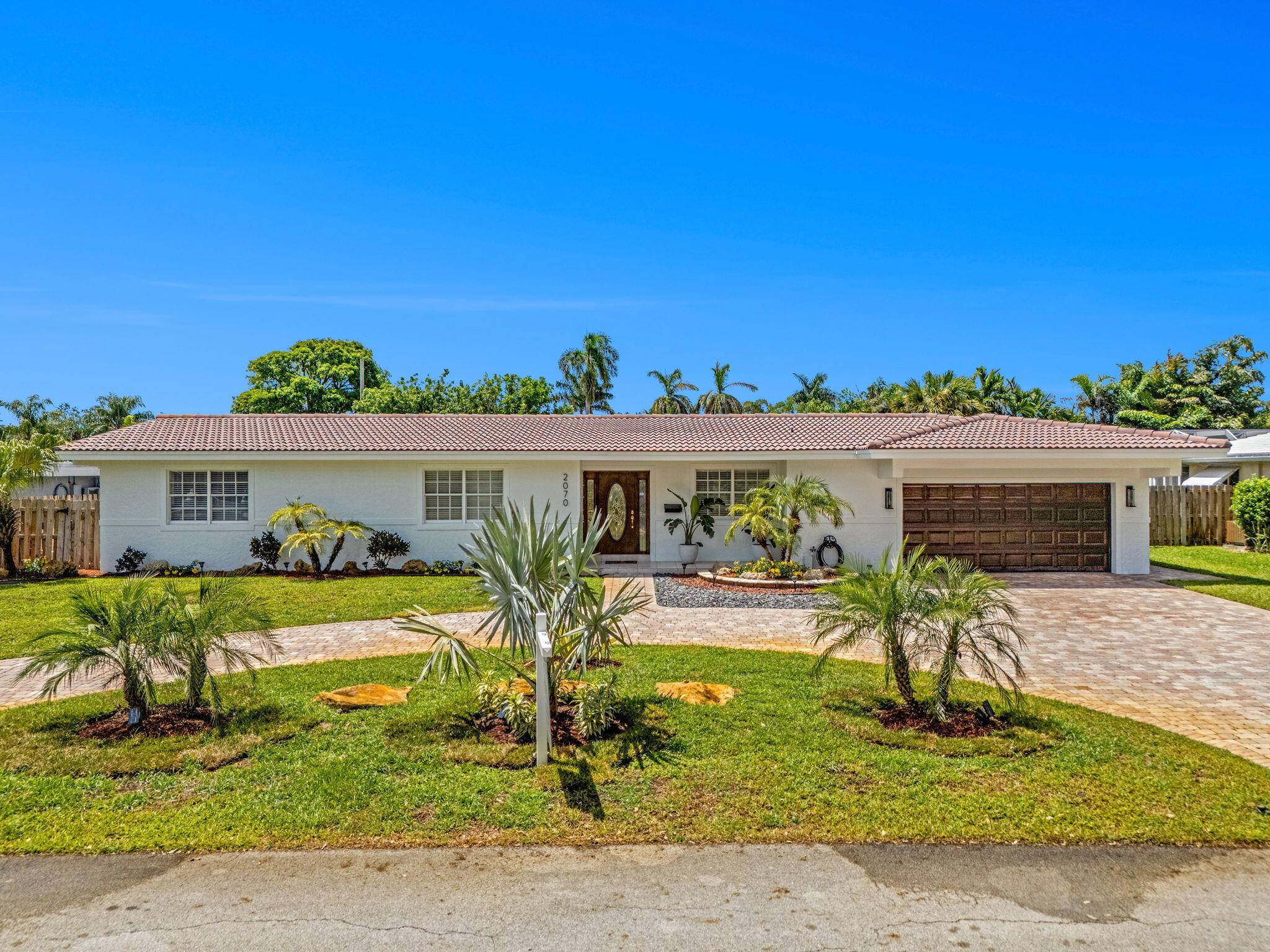Exceptional renovation three bedroom two bath two car garage pool home on one of the largest lots available in lighthouse point at 12, 325 feet.