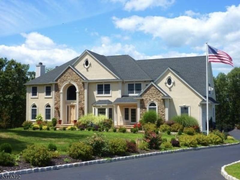 Situated on 2 private acres with panoramic mountain views, this 5, 300 sq ft center hall colonial offers luxury in a picturesque setting.
