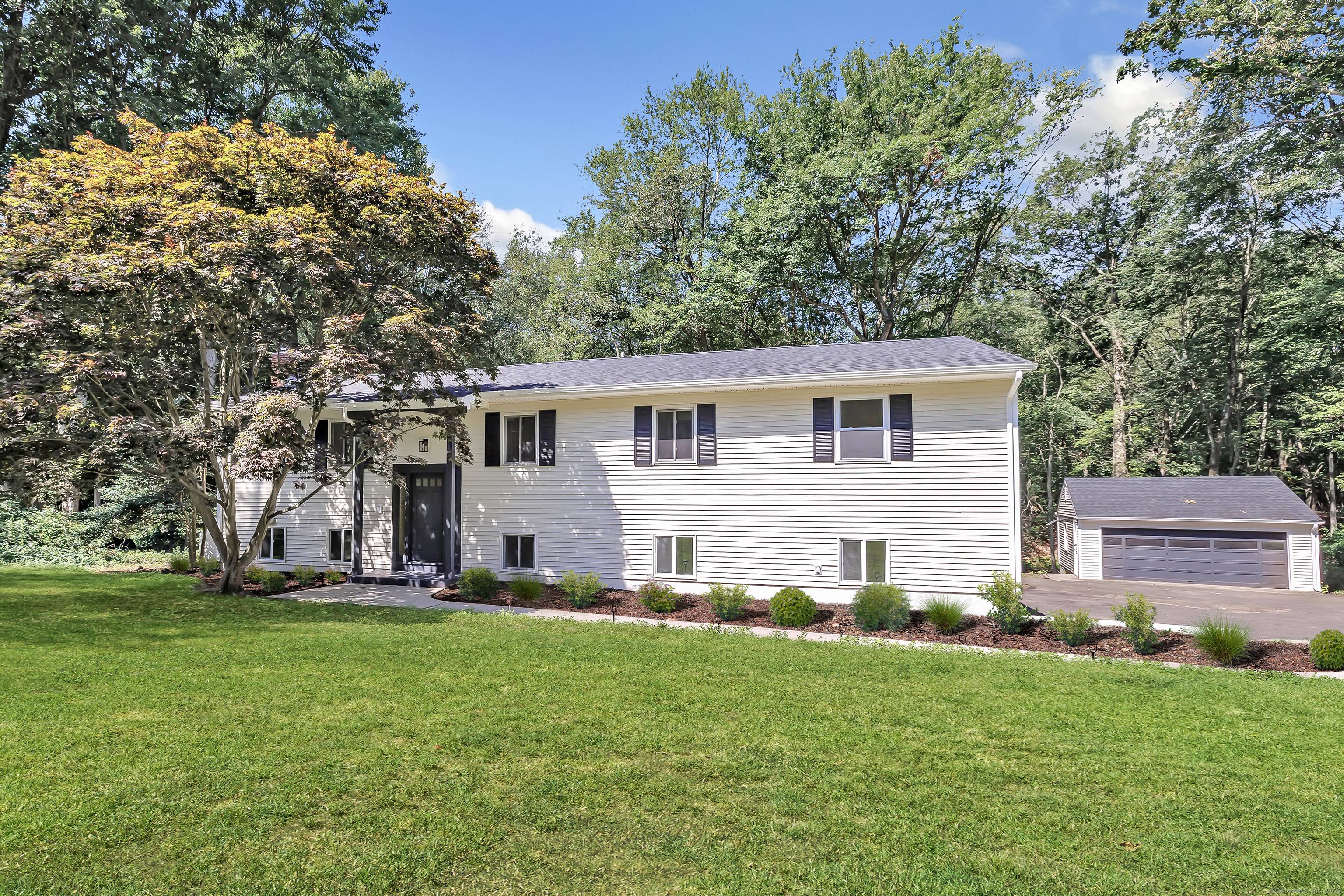Welcome home to this stunning, completely renovated expanded raised ranch with a legal accessory in law apartment.