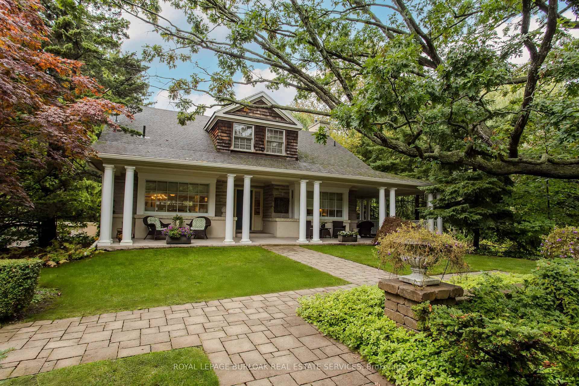 Rare opportunity to own a magical property across from the water with a double wide lot of 120 ft frontage.