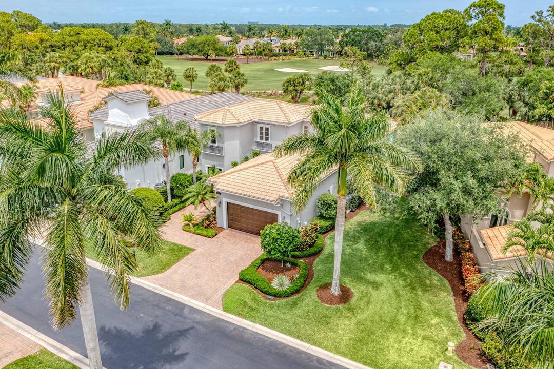 Exquisite Renovated Estate in Mirasol Country Club with Panoramic Golf Course Views.