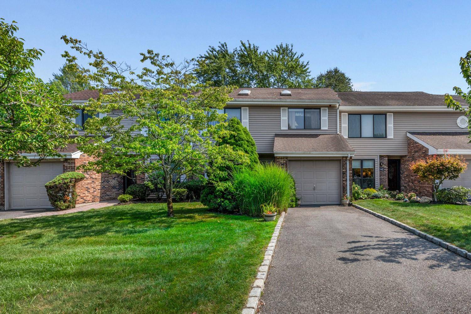 Welcome to Hidden Ponds, a sought after gated community in Smithtown !