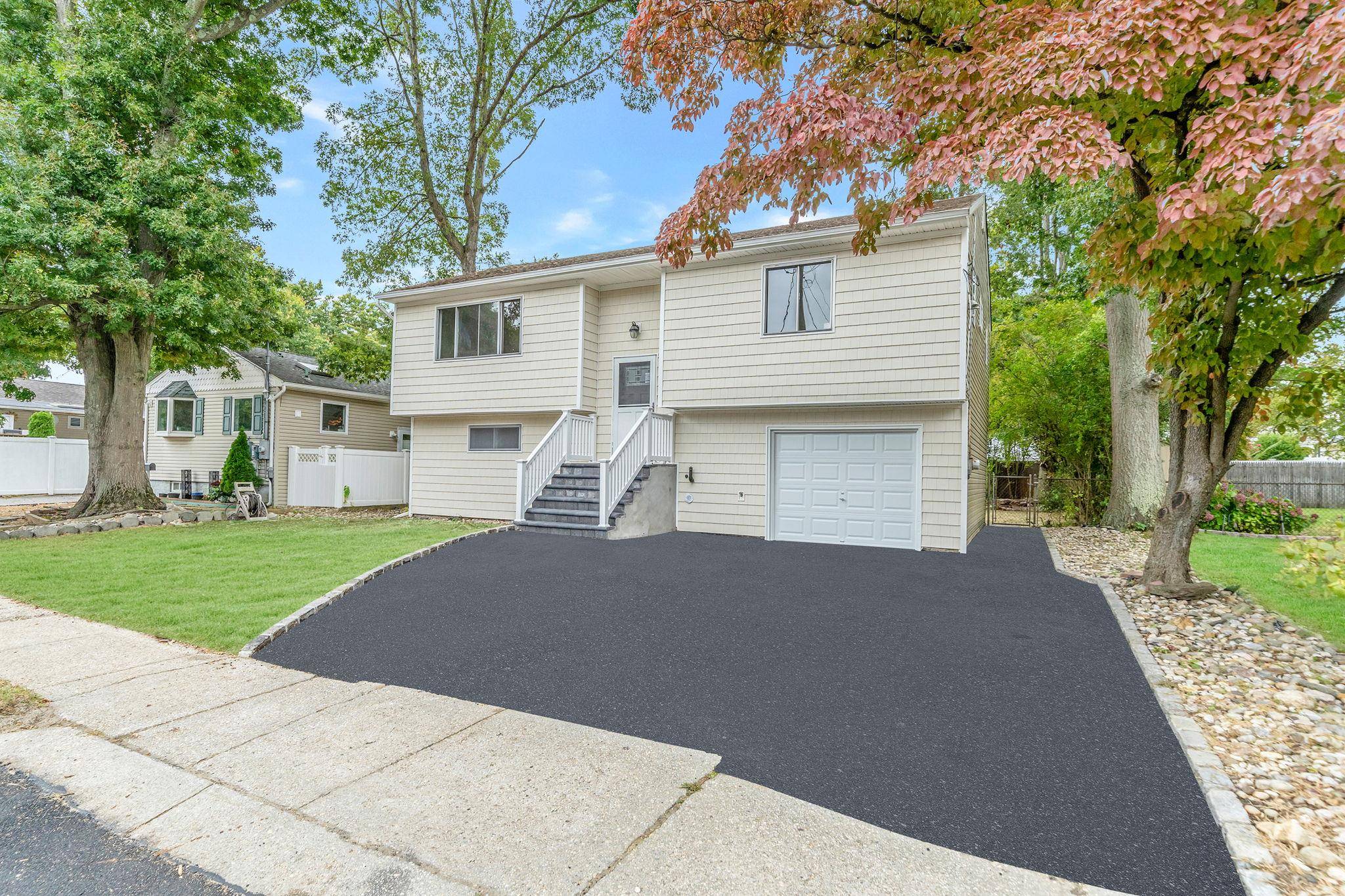 Beautifully Renovated 3 Bed 2 Full Bath Hi Ranch.