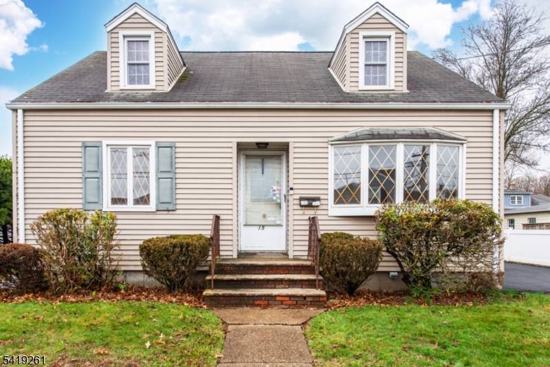 Opportunity awaits in this charming cape style home with large level yard nestled in a desirable location.