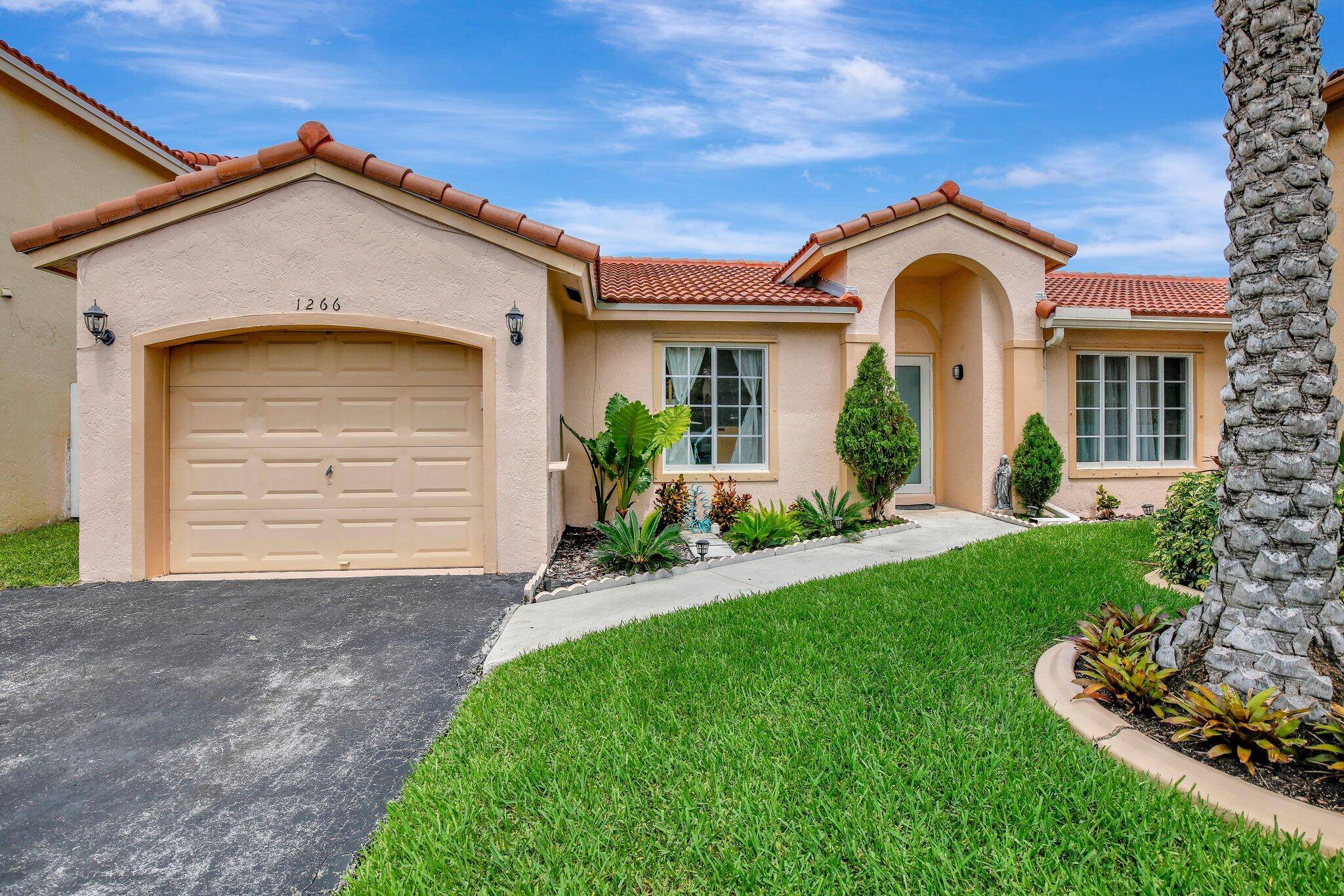 Charming 3 2 with a one car garage in a quiet enclave near all of the action in Sunrise !