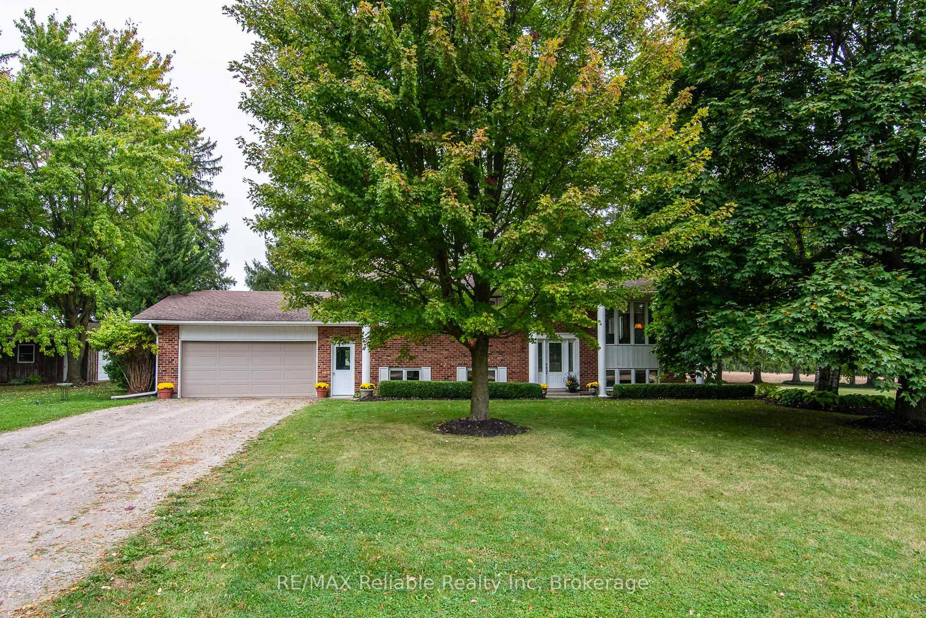 RAISED RANCH ON ONE ACRE WITH COUNTRYSIDE VIEWS !