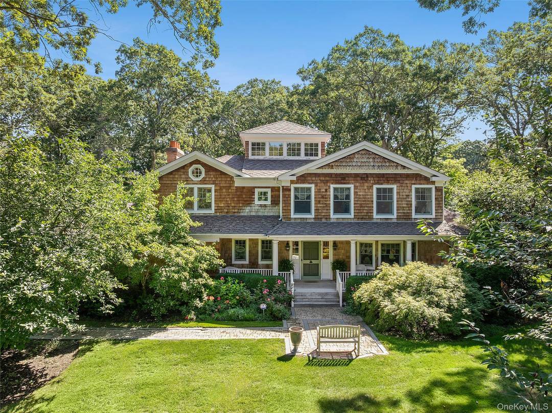 Set on 1. 33 acres at the end of coveted Cedar Lane, this fully renovated Post Modern offers both serenity and privacy amidst lush landscaping and gorgeous perennial gardens.